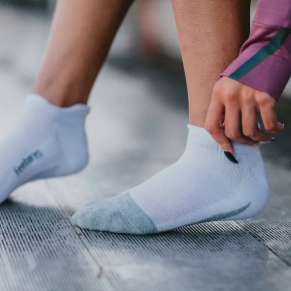 Woman wearing Feetures socks