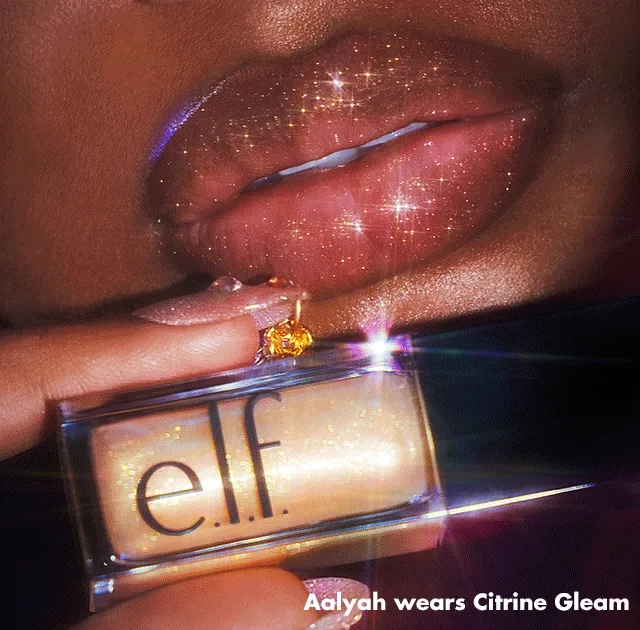 Model wearing Glow Reviver Lip Oil Glimmer Model wearing Glow Reviver Lip Oil Glimmer