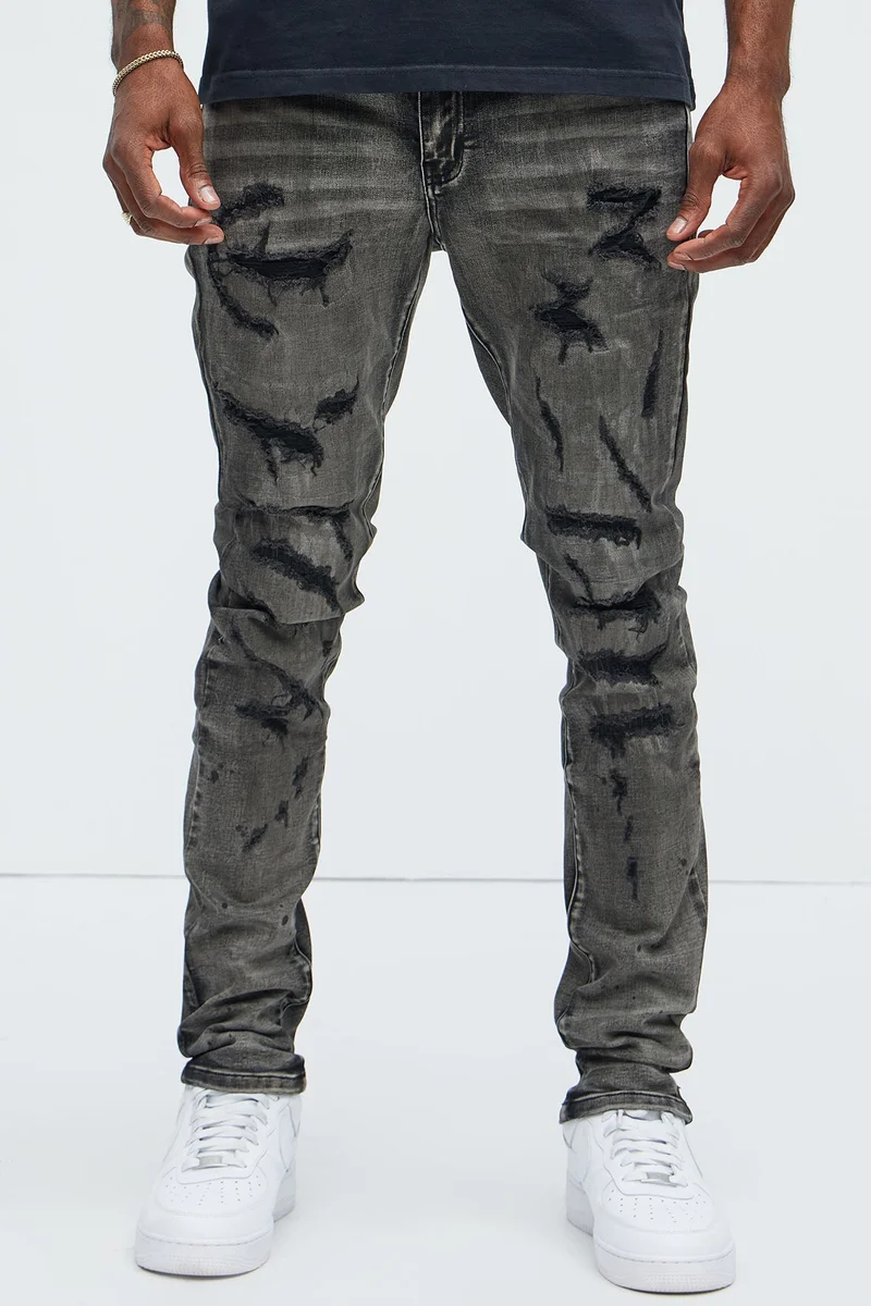 Image of Put You On Spray Painted Stacked Skinny Jeans - Black
