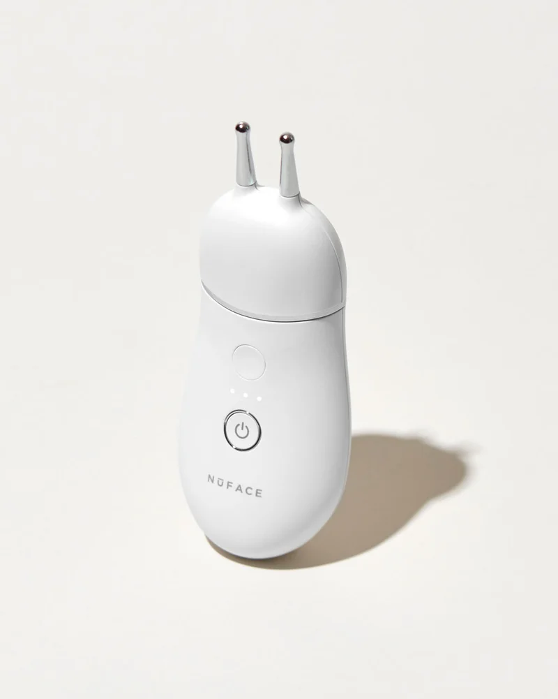 TRINITY+ Device with Effective Lip and Eye Attachment against white background.