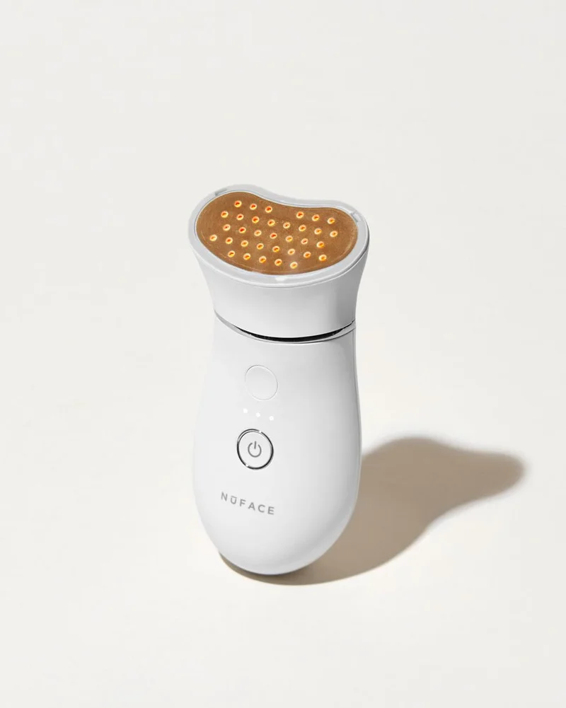 TRINITY+ Device with Wrinkle Reducer Attachment against white background.