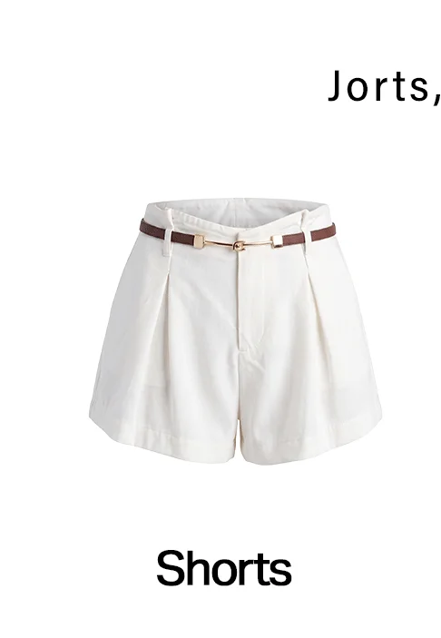White pleated high-waisted shorts with a brown belt.