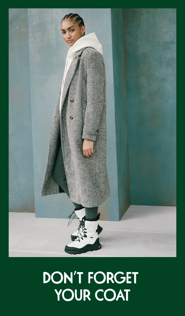 Woman wearing a long coat.