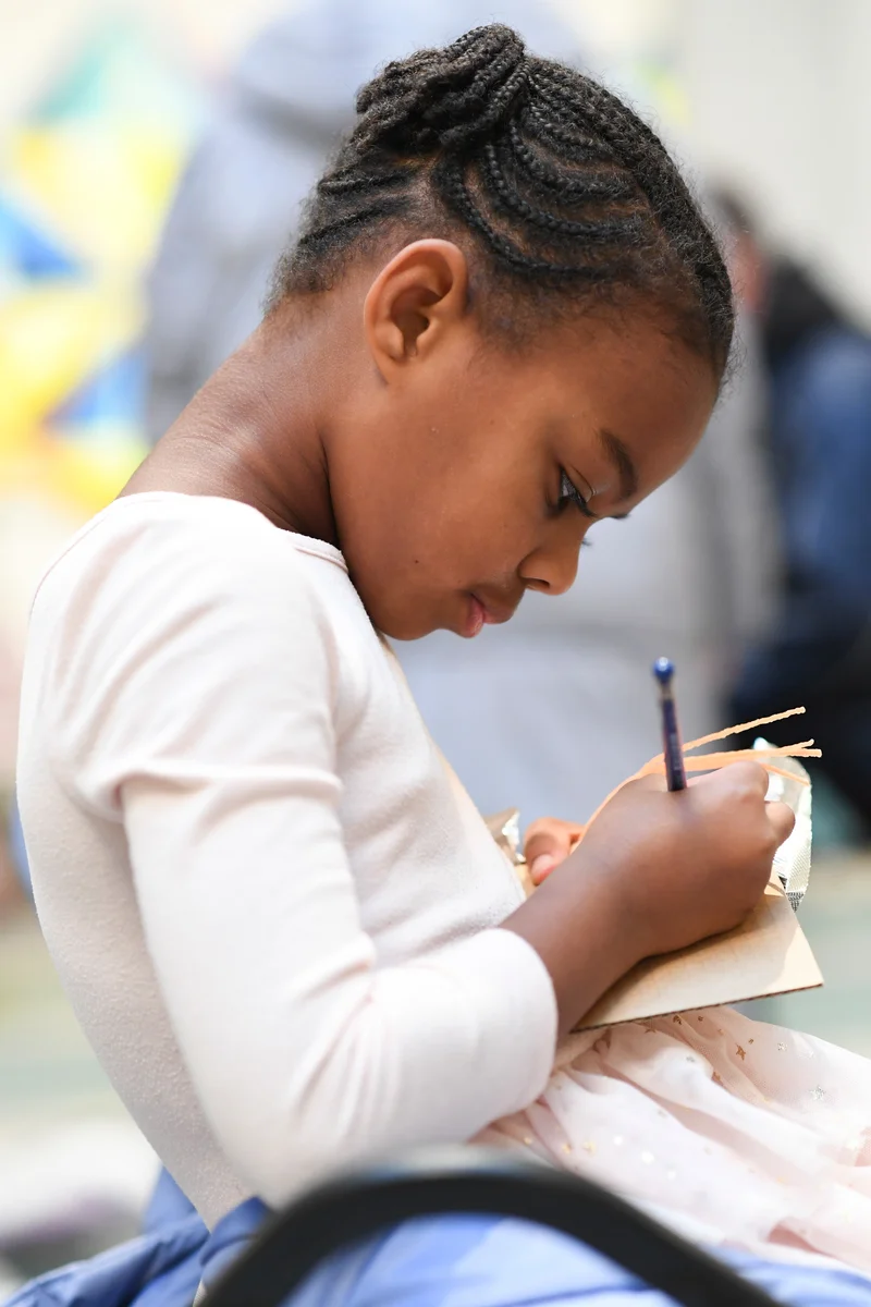 A child drawing in the galleries