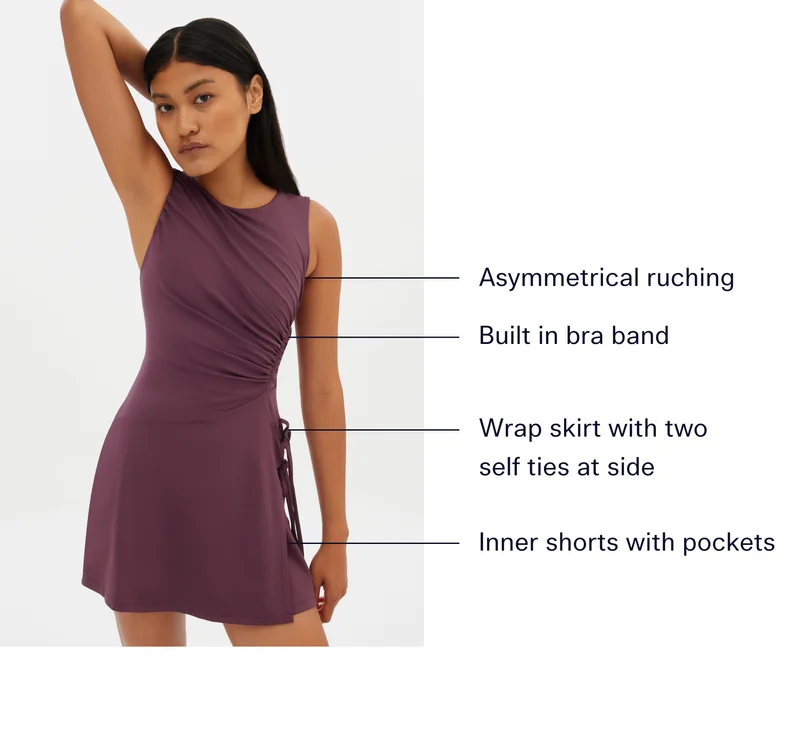 Asymmetrical ruching, Built in bra band, Wrap skirt with two self ties at side, Inner shorts with pockets