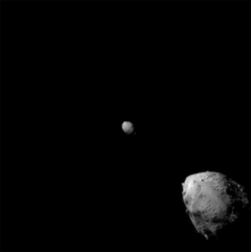 Double Asteroid Redirection Test (DART) spacecraft image of the asteroid Didymos (bottom right) and its moonlet (Dimorphos (centre)
