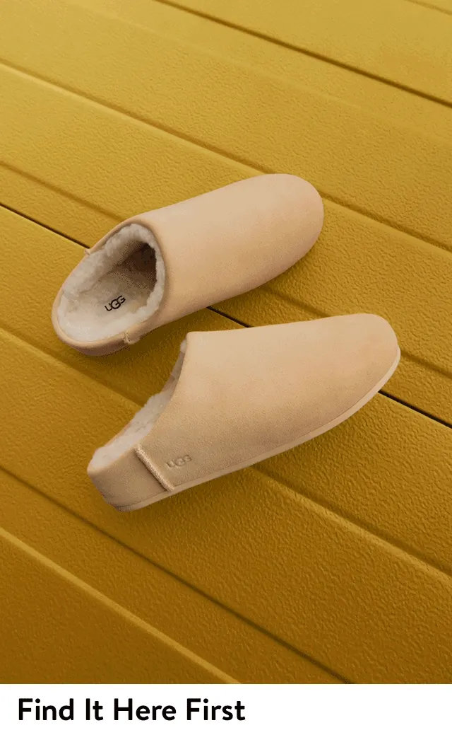 A woman wearing UGG slip-ons. UGG slip-ons in light and dark brown.