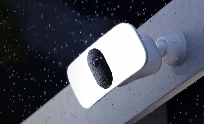 Arlo Pro 3 Wireless Floodlight at night in the rain.