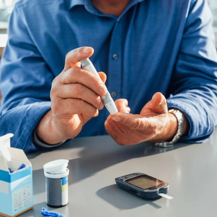 A patient checks their glucose levels.
