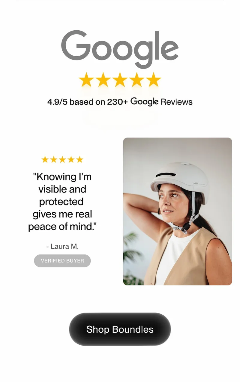 Woman wearing a white Boundles helmet smiling confidently — 4.9/5 Google rating from 230+ verified reviews