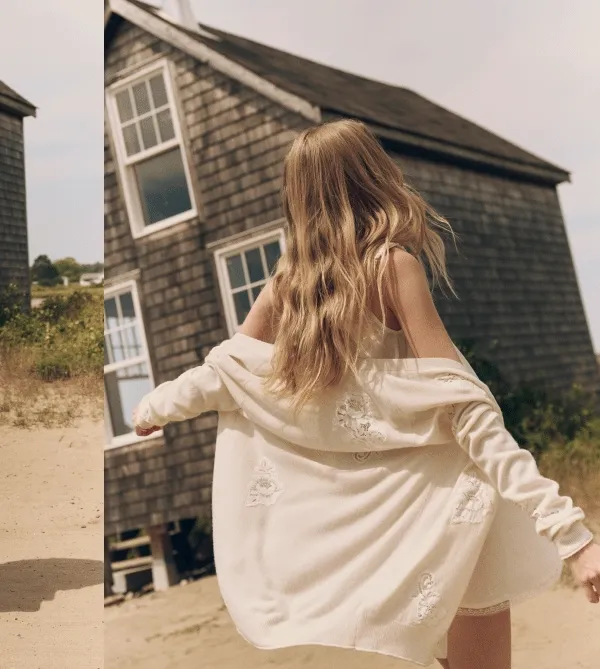 Girl on a beach in white casual dress