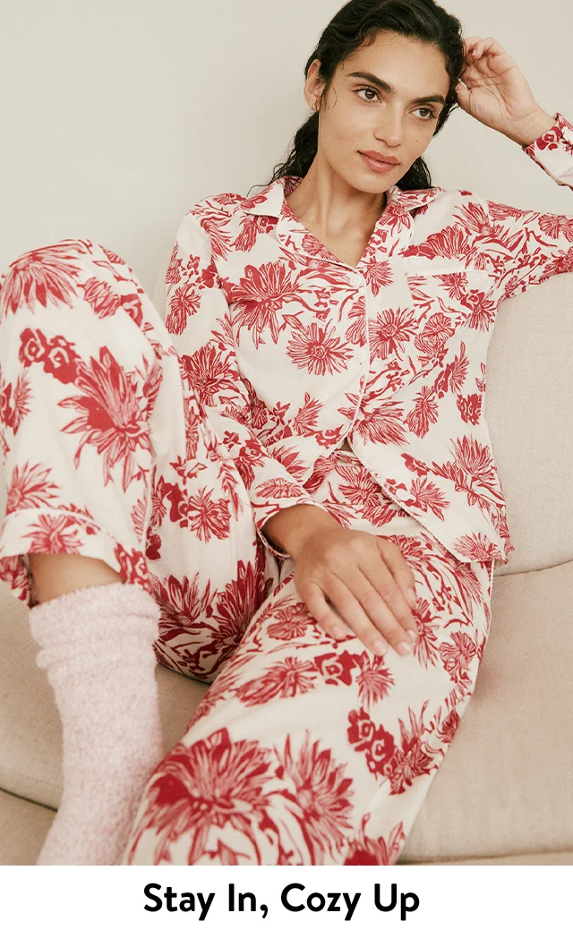 A woman wearing floral-print pajamas.