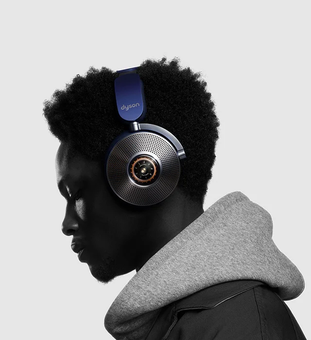 Side view of a man wearing the Dyson Zone noise-cancelling headphones