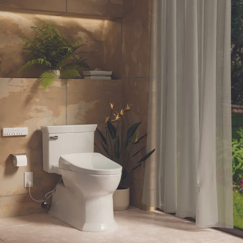A TOTO Soirée One-Piece Toilet sits in a sunlit bathroom.