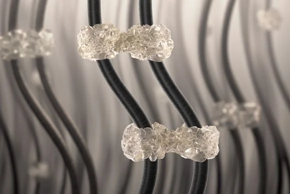 Microscopic view of hair styled with traditional styling products that stick hair fibers together.