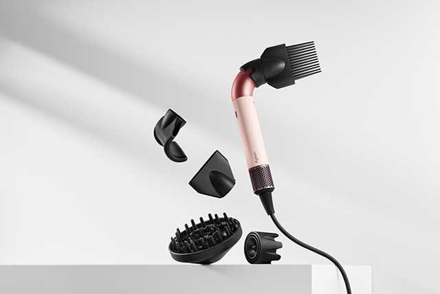 The Dyson Supersonic r hair dryer with a range of attachments.