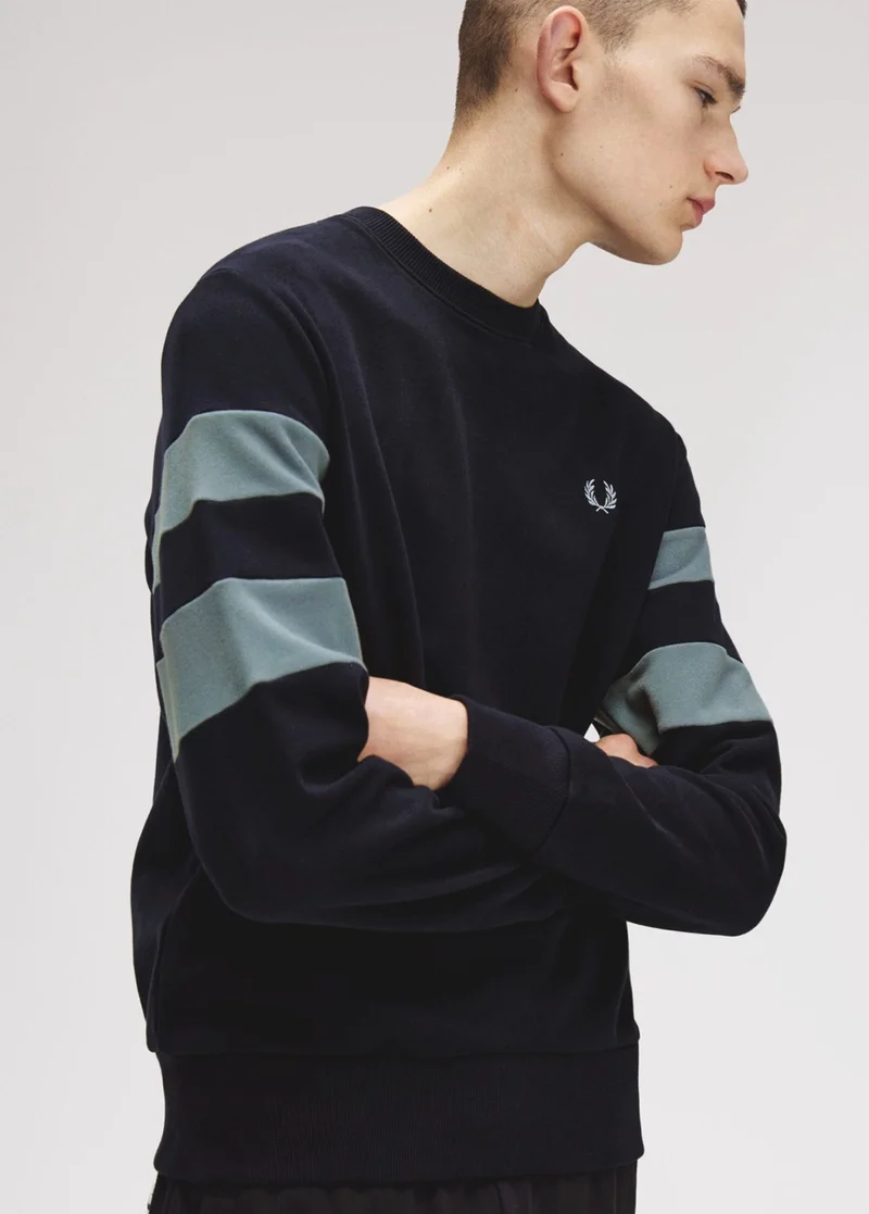 Male model wearing a Peached Tipped Sleeve Sweatshirt in Navy