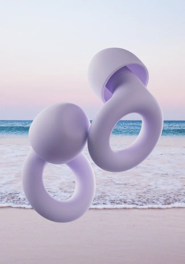 A set of Violet Loop Quiet earplugs in front of an ocean backdrop.
