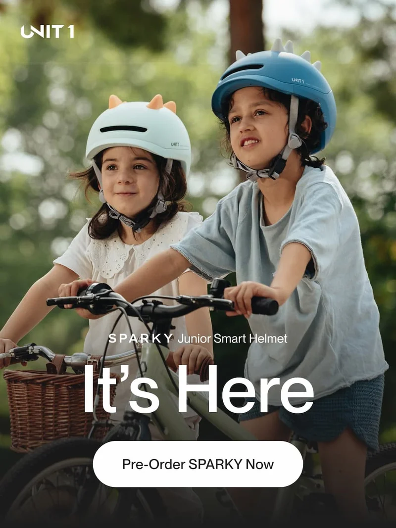 Children wearing the SPARKY Junior Smart Helmet, looking ahead with the headline: 'It's Here'.