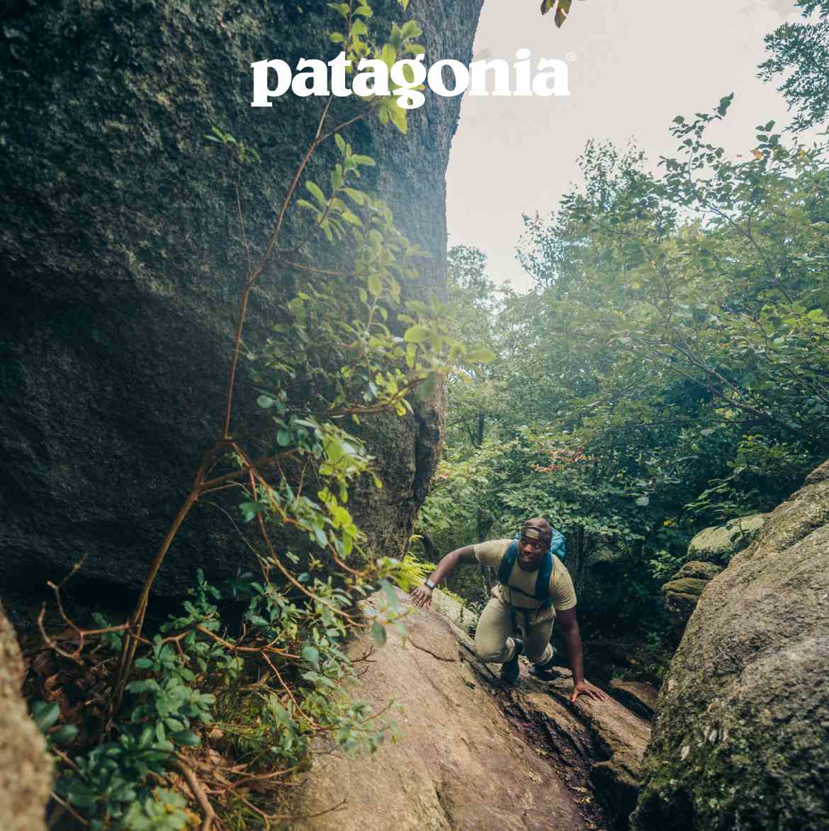 Patagonia. Photo of a person scrambling up a rock face.