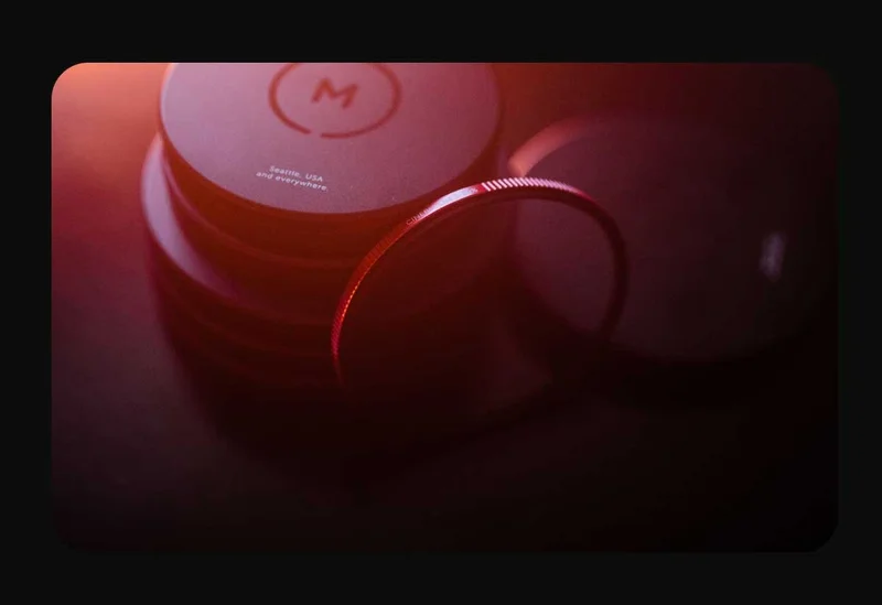 Images of Moment Filters laying on a table in dramatic light.