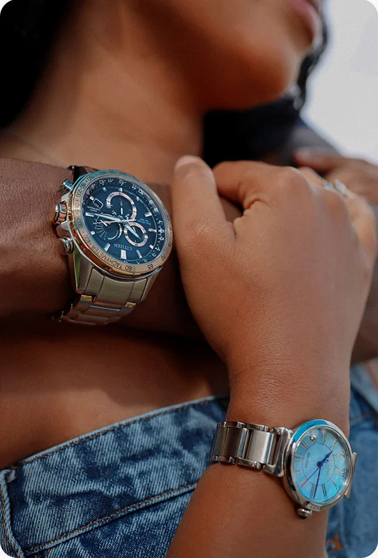 A couple wearing citizen watches