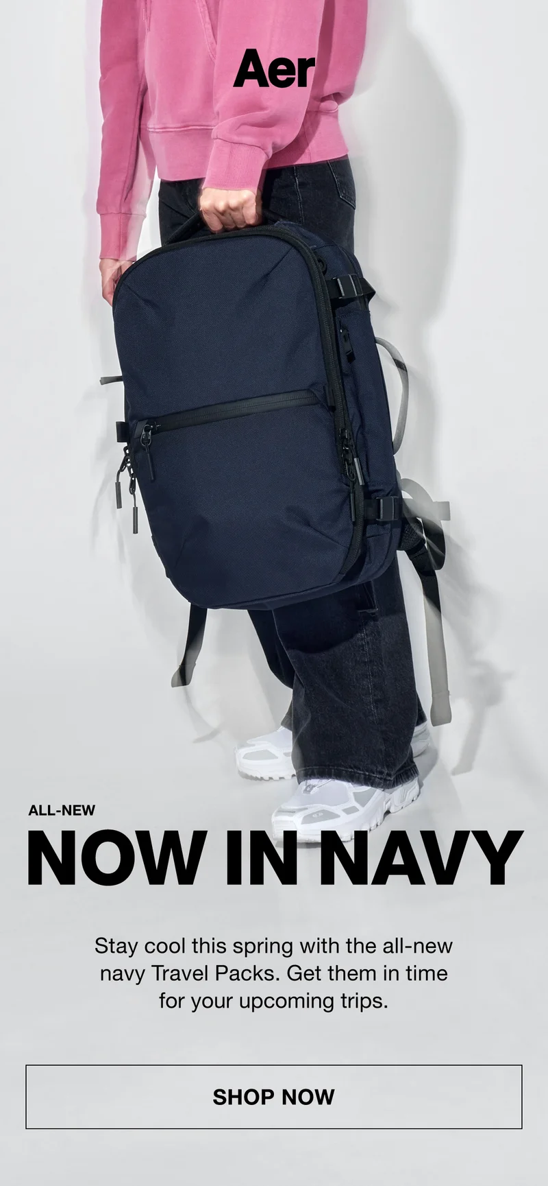 Model holding the Aer Travel Pack 3 in Navy