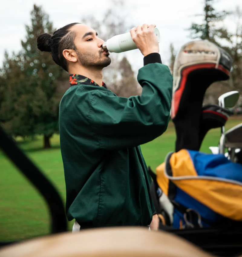 Man drinking from LARQ Bottle PureVis™ in Granite White