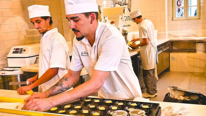 Image description: Chefs preparing pastel de nata during a cooking class in Lisbon.