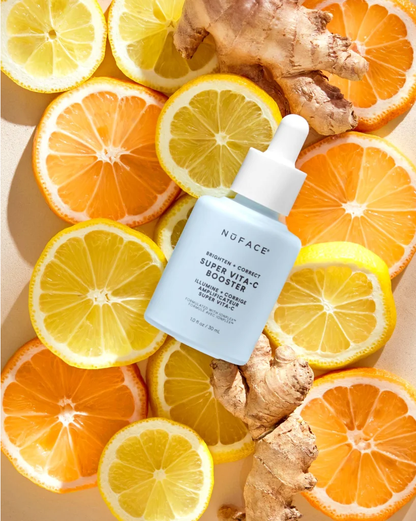 Product image of Super Vita-C Booster laying on top of slices of oranges and ginger.