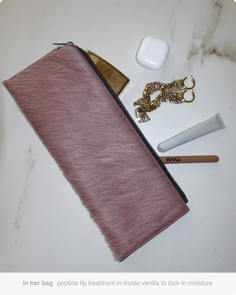 in her bag peptide lip treatment in rhode vanilla to lock in moisture
