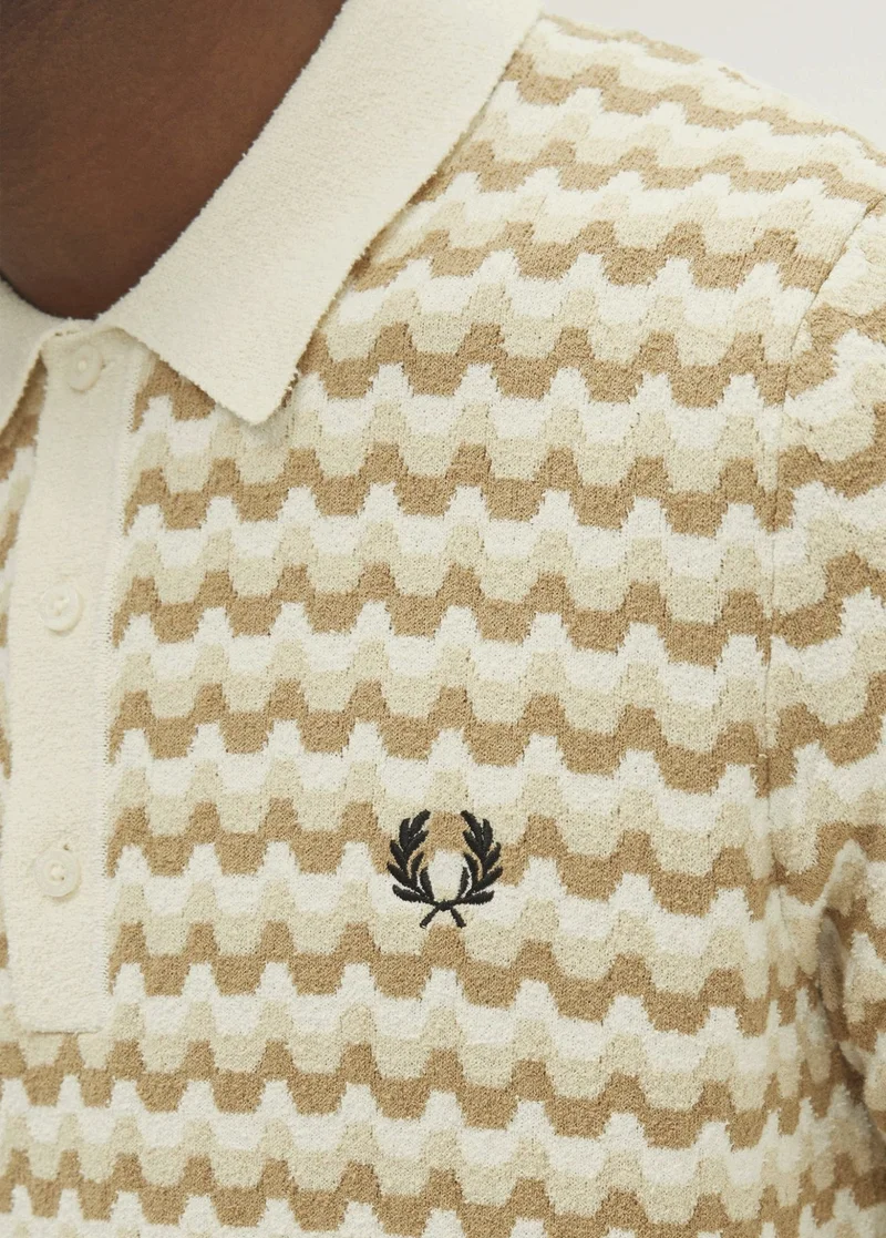 Man wearing knitted Fred Perry Shirt