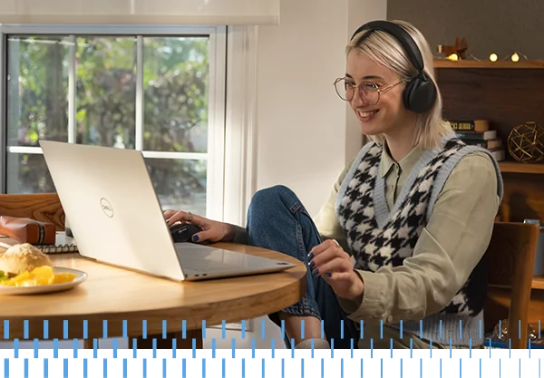 Happy Young Woman Working From Home Dining Table