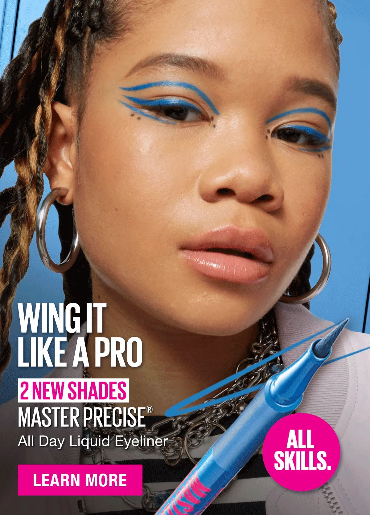 a woman with blue eyeliner and makeup