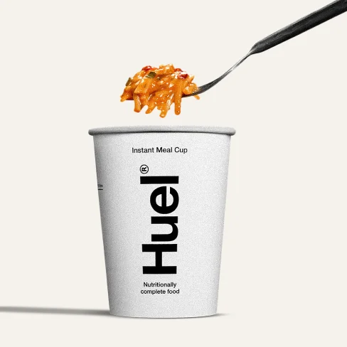 One Huel cup with a fork and noodles