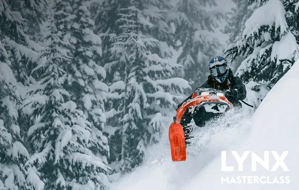 Lynx riders driving in the deep snow
