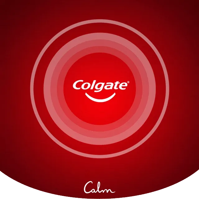 Colgate logo centered over soft, pulsating circles on a red background. Below it, the text reads ‘breathe in,’ with the Calm logo beneath.