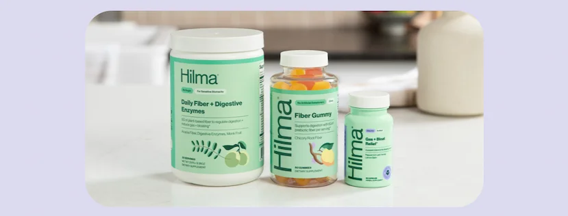 Hilma's Daily Fiber + Digestive Enzymes, Fiber Gummy, and Gas + Bloat Relief on a countertop.