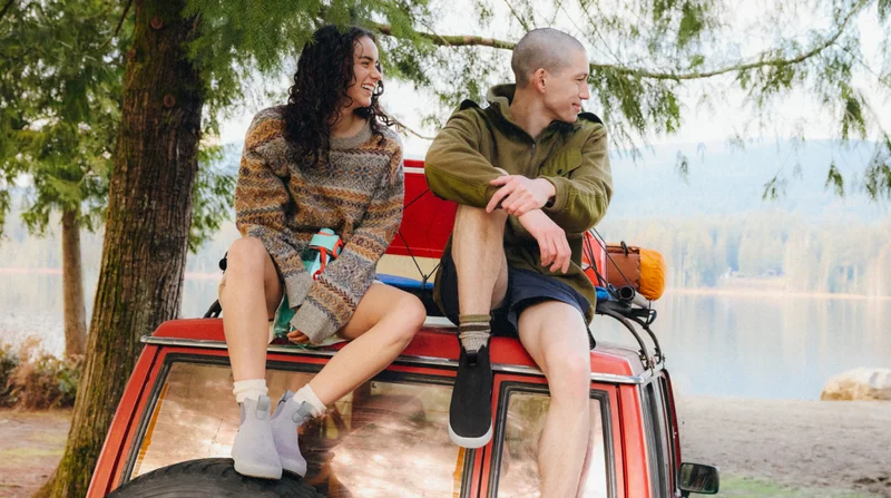 Hero graphic of two people sitting on the roof of their car wearing their Weekend Chelseas.