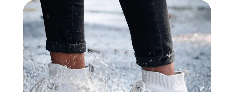 Graphic of someone wearing their Stormburst Sneakers in a puddle.