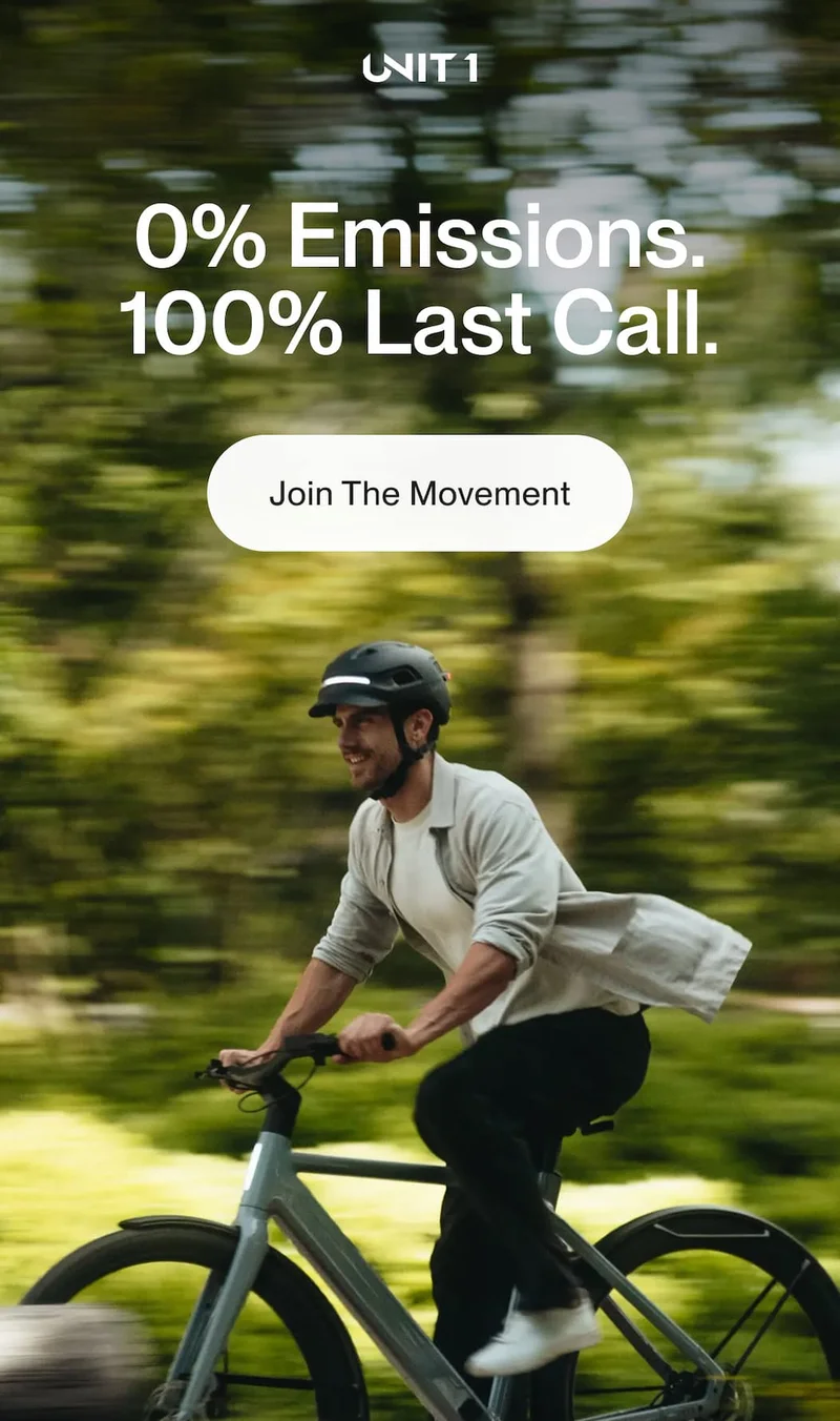 Cyclist wearing a UNIT 1 helmet with Earth Day last-call message and Join The Movement CTA.