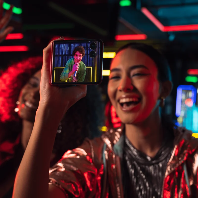 A person taking a picture with the motorola razr+ 2024
