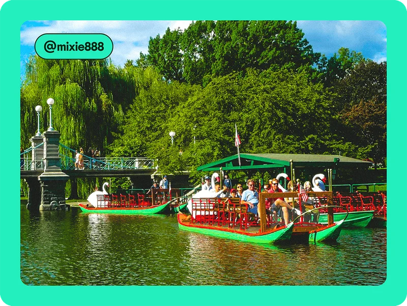 Image description: A group of travelers are passengers on a boat gliding down a river. In the background, there’s a bridge where people are walking.