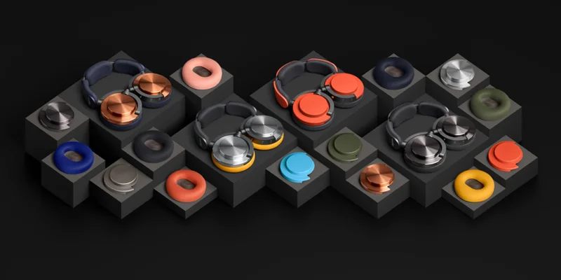 Dyson OnTrac headphones displayed next to a variety of cushions and caps