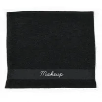 A black towel with 'Makeup' embroidered in white, just one of the curated selections designed for Ace Hotel Shop bath collection.