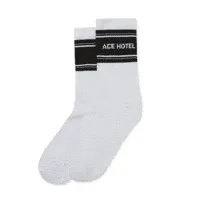 Animated GIF cycling through Ace Hotel's diverse sock designs, including a highlighted pair of white crew socks with the Ace Hotel logo.