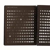 Animated GIF featuring a selection of Ace Hotel's stationery items, including a detailed notebook and stylish sticker designs.