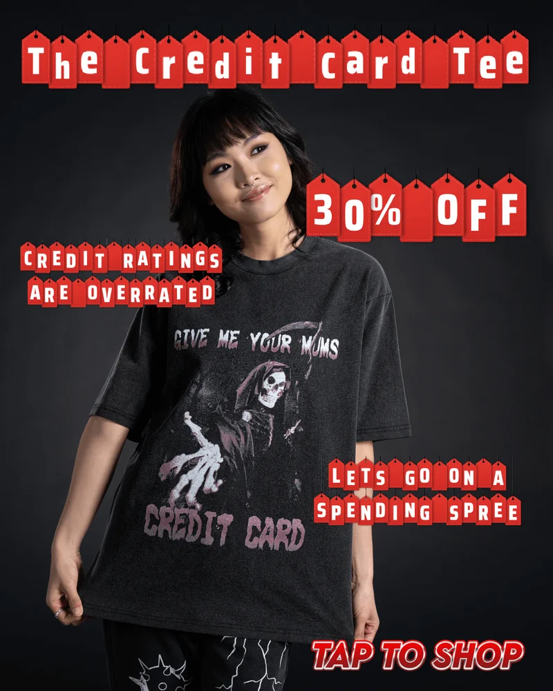 The Credit Card Tee. 30% off. Credit ratings are overrated. Let's go on a spending spree. Tap to shop. [image of young smiling woman wearing The Credit Card Tee standing in front of a black background]
