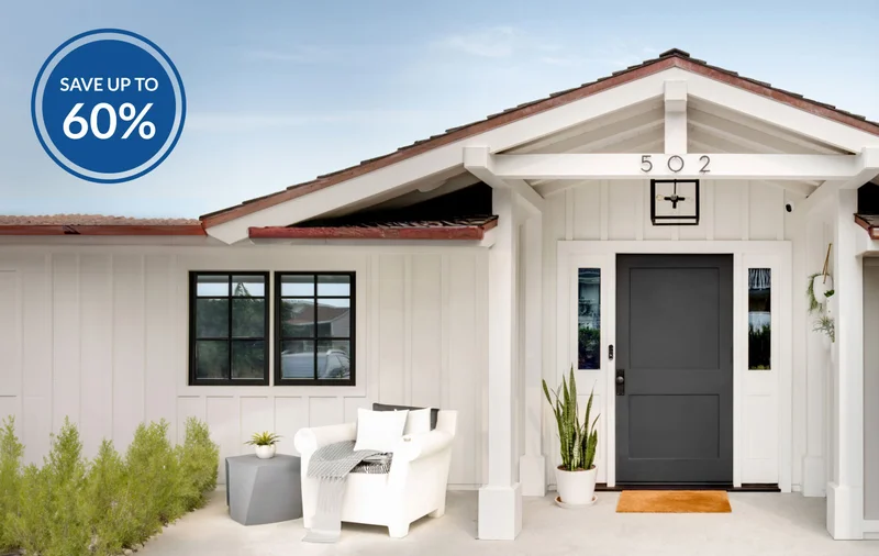 Up to 60% off. Various Arlo security products mounted near the  front door of a home.