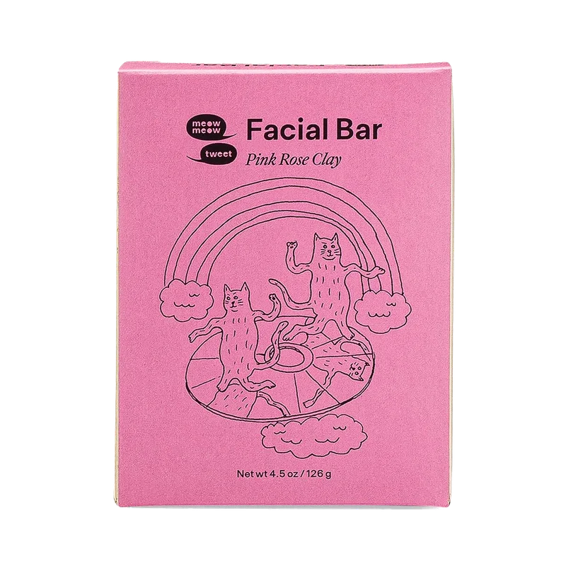 A pink paper box soap box with black line illustrations of cats.